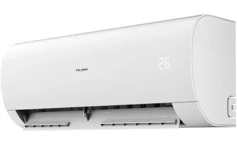 Biała jednostka klimatyzacyjna Haier Pearl Plus z cyfrowym wyświetlaczem temperatury 26 stopni Celsjusza.