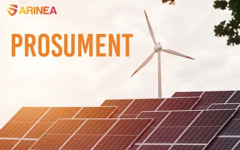 Panele fotowoltaiczne i turbina wiatrowa symbolizują przyszłość energetyki, gdzie prosument odgrywa kluczową rolę.